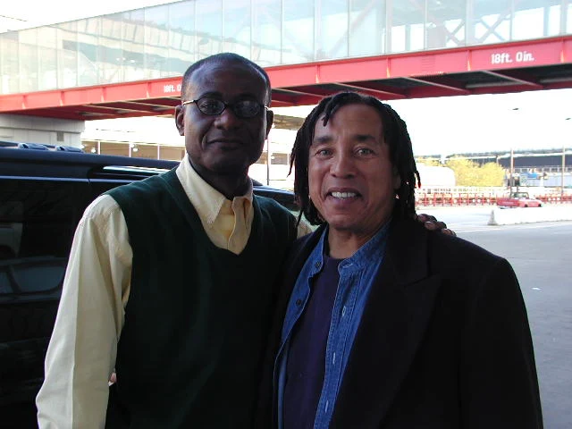Leslie Beckett Samuel posing with Motown Legend and American famed Entertainer William "Smokey" Robinson at  the Chicago O'Hare Airport after a week of public relations and promotional events by the Mayo Communications International